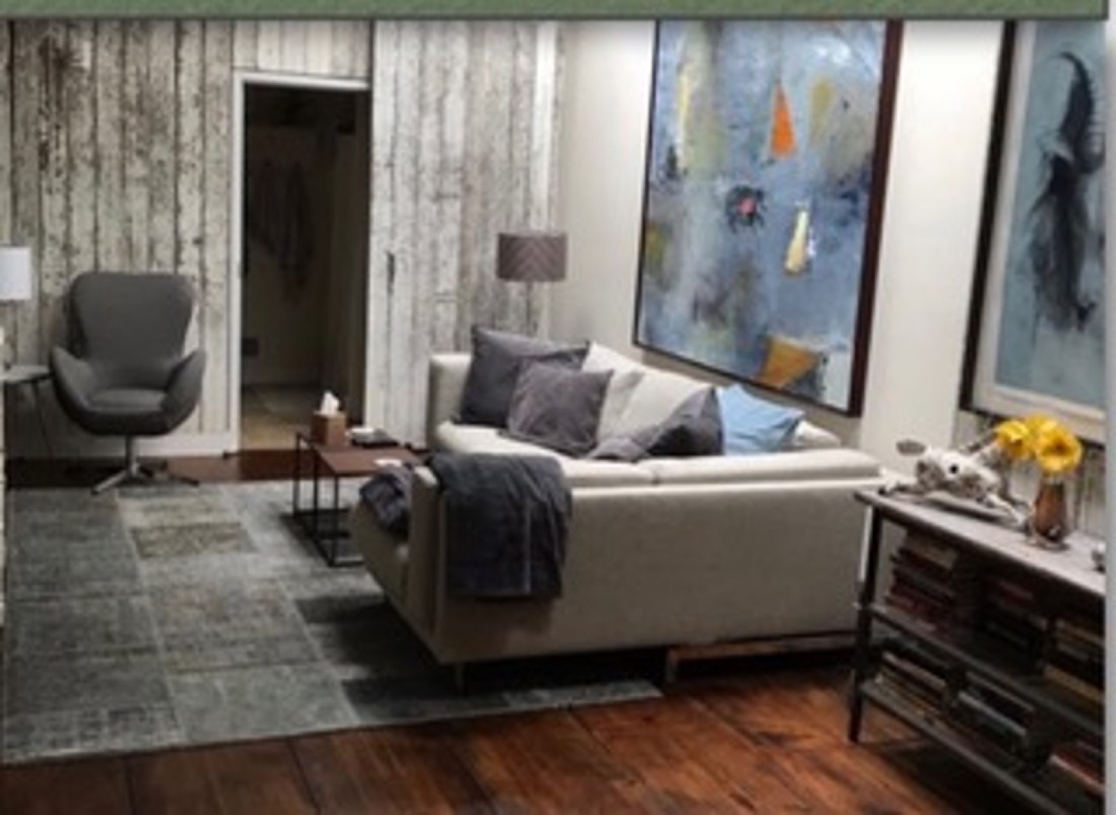 Second-floor living room with art