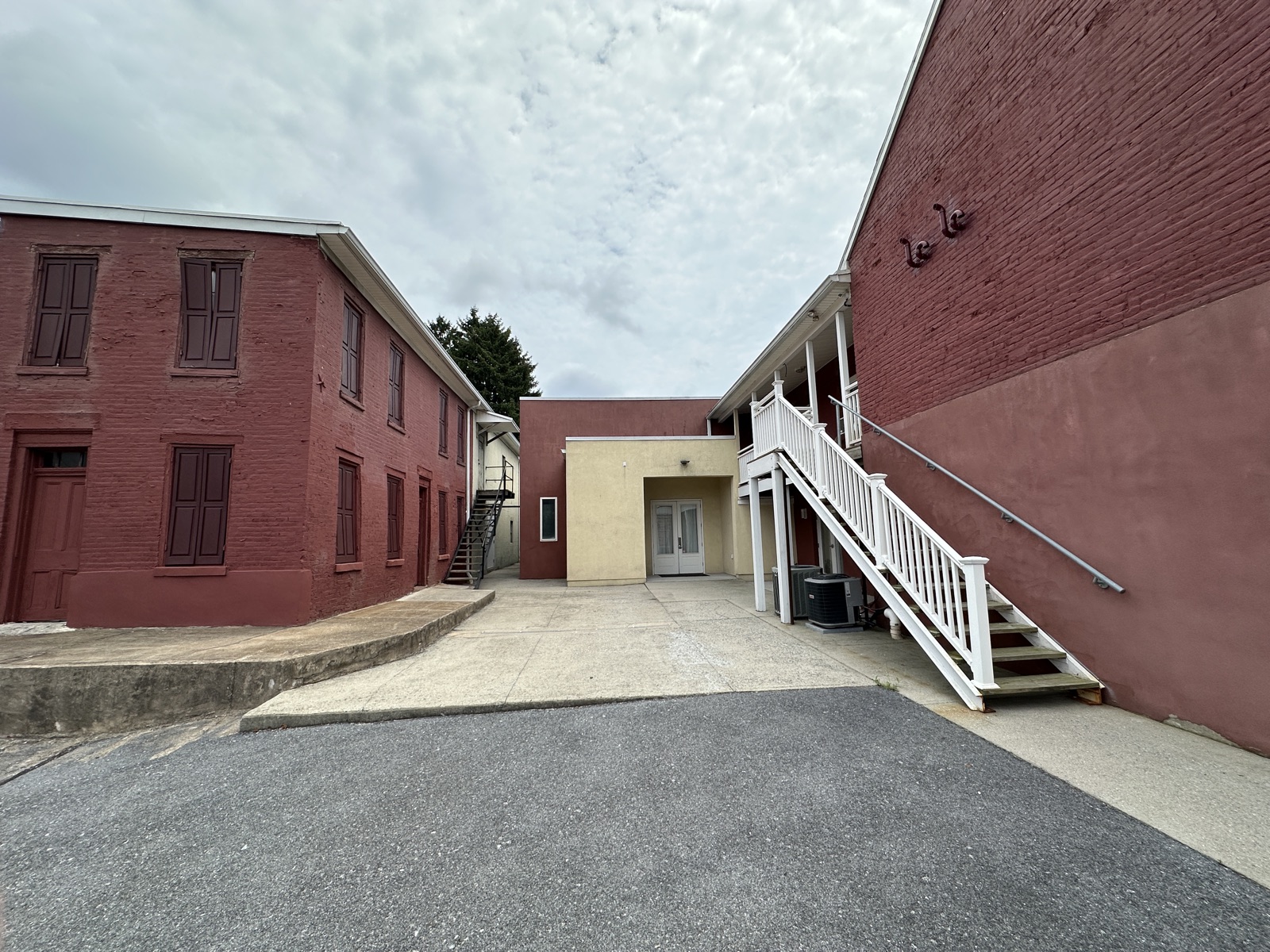 The courtyard and yellow entrance at 123 N. Third